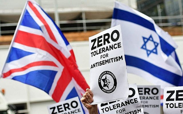 Antisemitism signs during a protest in London against rising Jew-hate. (Photo credit: Dominic Lipinski/PA Wire via Jewish News)