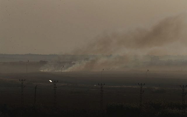 In this photo taken from the Turkish side of the border between Turkey and Syria, in Akcakale, Sanliurfa province, southeastern Turkey, smoke billows from target in Tel Abyad, Syria, during bombardment by Turkish forces, Saturday, Oct. 12, 2019.  (AP Photo/Lefteris Pitarakis - Jewish News)