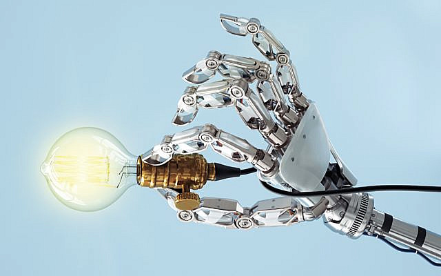 High tech hand with a classic light bulb. How much will AI control its creator?