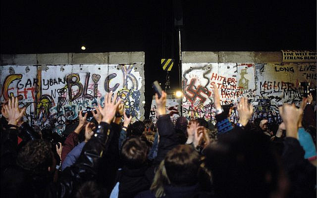 The Berlin Wall opens in November 1989. (Patrick PIEL/Gamma-Rapho via Getty Images)