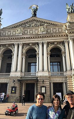 Rich Leib, Sharon Rosen Leib and guide Alex Denishenko in front of L'viv's Opera House.