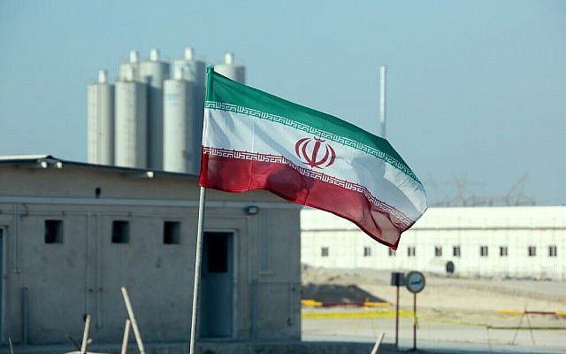 An Iranian flag flutters at Iran's Bushehr nuclear power plant on November 10, 2019. (Atta Kenare/AFP)