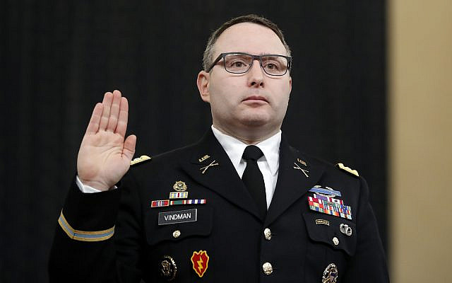 National Security Council aide Lt. Col. Alexander Vindman is sworn in to testify before the House Intelligence Committee on Capitol Hill in Washington, Nov. 19, 2019, during a public impeachment hearing of President Donald Trump's efforts to tie U.S. aid for Ukraine to investigations of his political opponents. (AP Photo/Andrew Harnik)