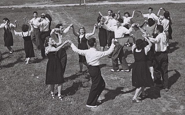 Kibbutznikim joyously dancing in Israel.