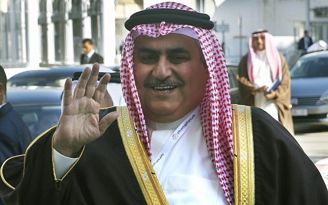 Bahraini Foreign Minister Khalid bin Ahmed Al Khalifa, waves to journalists upon his arrival to attend the opening session of the Arab foreign ministers meeting ahead of the Arab Summit, in Tunis, Friday, March 29, 2019. (AP Photo/Hussein Malla)
