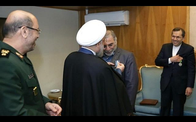 Iran’s President Rouhani pins a “second-class service” badge on Brig.-Gen. Mohsen Fakhrizadeh on February 19, 2016. Watching on the left is then-Defense Minister General Hossein Dehqan. (via JCPA)