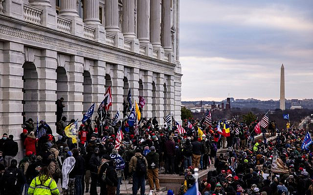 A pro-Trump mob storms the US Capitol following a rally with President Donald Trump on January 6, 2021, in Washington, DC. Trump supporters gathered in the nation's capital today to protest the ratification of President-elect Joe Biden's electoral college victory over President Trump in the 2020 election. (Samuel Corum/Getty Images via JTA)