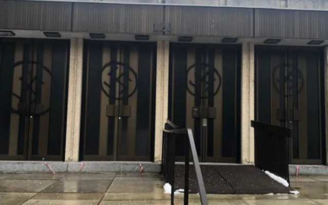 Swastikas were spray-painted on Montreal's Congregation Shaar Hashomayim's front doors, January 13, 2021. (Friends of Simon Wiesenthal Center)