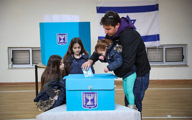 Casting a ballot at a voting station in Jerusalem, during the Knesset elections, on March 2, 2020. (Olivier Fitoussi/Flash90)