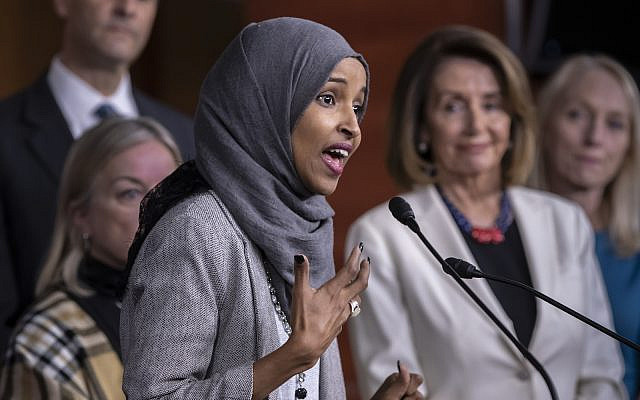 In this Nov. 30, 2018 photo, Rep.-elect Ilhan Omar addresses a news conference at the Capitol in Washington, with House Democratic Leader Nancy Pelosi of California, right (AP Photo/J. Scott Applewhite)