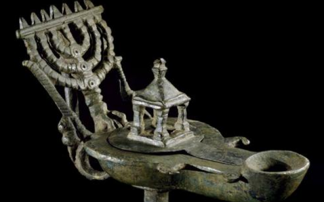 Hicham Aboutaam: Jewish bronze lamp with the handle in the shape of a menorah