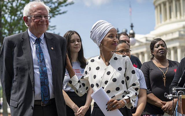 Sen. Bernie Sanders, I-Vt., and Rep. Ilhan Omar, D-Minn., at a news conference at the Capitol on June 24, 2019. J. Scott Applewhite | AP