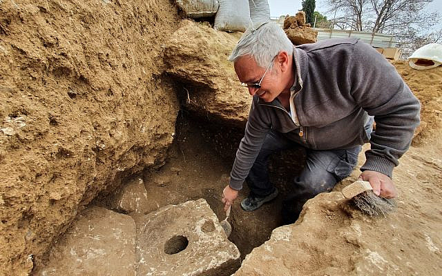 An Israel Antiquities Authority archeologist at the site of the recently unearthed toilet from the First Temple-period in Jerusalem (Yoli Schwartz / Israel Antiquities Authority)