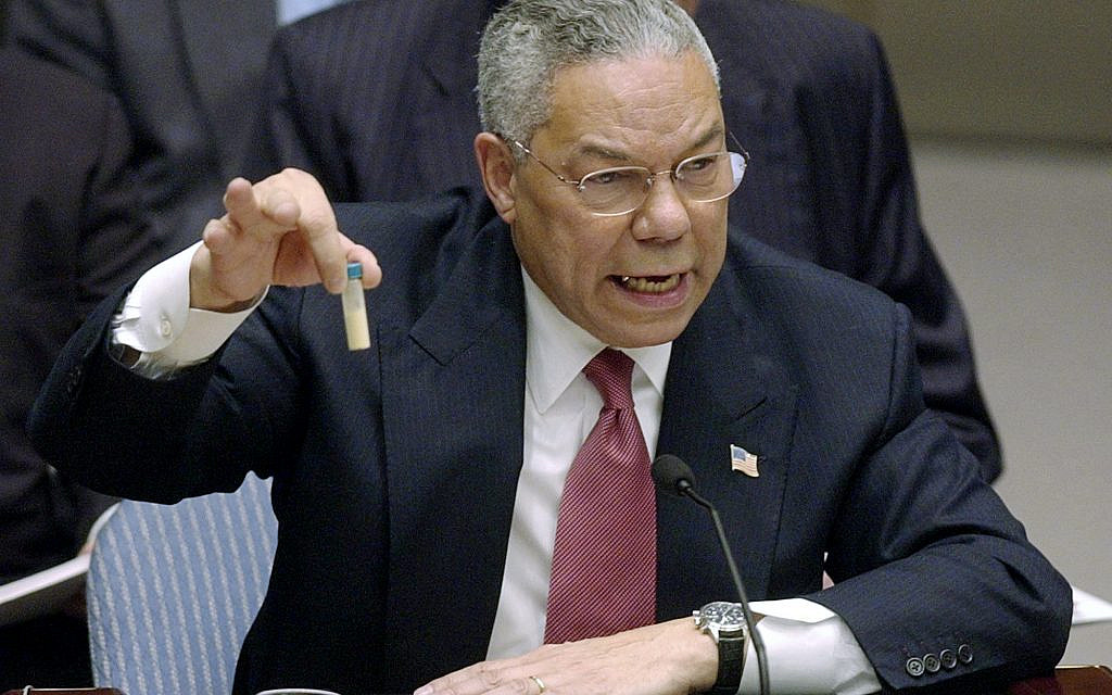 Secretary of State Colin Powell holds up a vial he said could contain anthrax as he presents evidence of Iraq's alleged weapons programs to the United Nations Security Council. Feb. 5, 2003 (AP Photo/Elise Amendola, File)