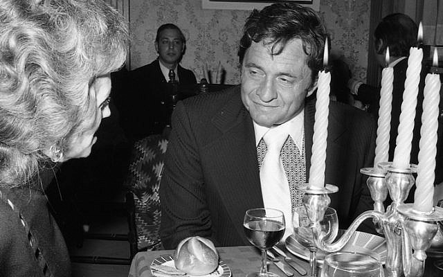 Johnny Cash in conversation with a guest at the reception in his honor in Jerusalem, November, 1971. Photo by IPPA Staff, the Dan Hadani Collection, the Pritzker Family National Photography Collection at the National Library of Israel.