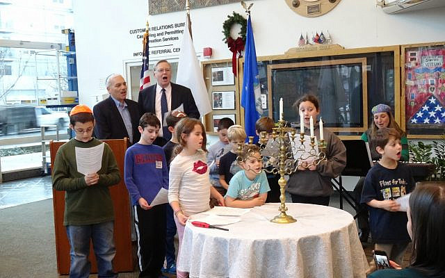 Lighting the menorah with the mayor at Stamford, Connecticut's Government Center. (courtesy)