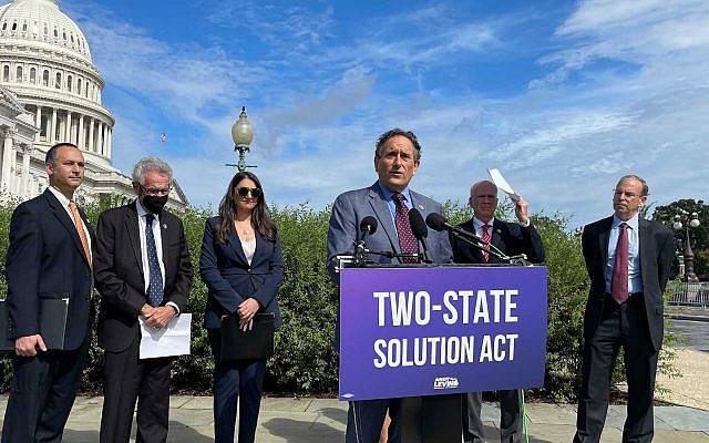 US Rep. Andy Levin speaks at a press conference introducing his 'Two-State Solution Act,' on Capitol Hill, September 23, 2021. He is flanked by, from left: Hadar Susskind, the president and CEO of Americans for Peace Now; Rep. Alan Lowenthal; Rep. Sara Jacobs; Rep. Peter Welch; and J Street President Jeremy Ben-Ami. (Ron Kampeas/JTA, via The Times of Israel)