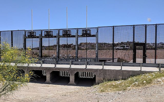 The border fence between El Paso, Texas and Juarez has an elaborate gate structure to allow floodwaters to pass under. The grates prevent people being able to cross under, and can be raised for floodwaters carrying debris. Beyond the fence is a canal and levee before the Rio Grande. (Dicklyon - Own work, CC BY-SA 4.0, Wikipedia Commons)