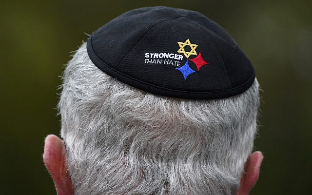 Tree of Life Synagogue Vice President Alan Hausman wears a Stronger Than Hate yarmulke during a commemoration ceremony in Pittsburgh's Squirrel Hill neighborhood, Wednesday, Oct. 27, 2021. A gunman killed 11 worshippers at the Tree of Life Synagogue, in America's deadliest antisemitic attack in 2018. (AP Photo/Gene J. Puskar)