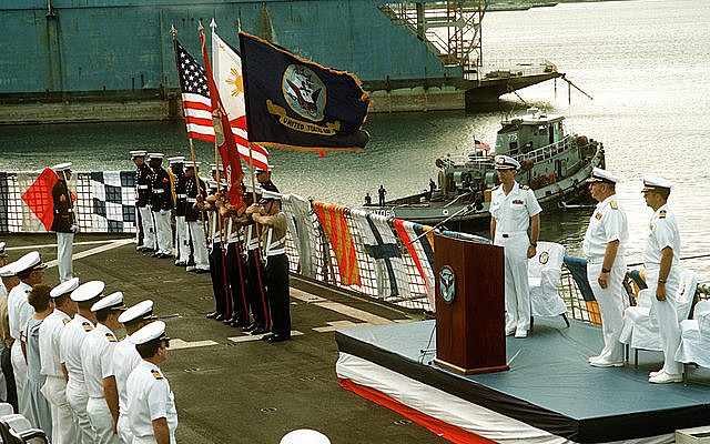 A U.S. Marine Corps color guard presents the colors during the Pearl Harbor 50th Anniversary Memorial Service being held aboard the amphibious command ship USS BLUE RIDGE (LCC-19).
