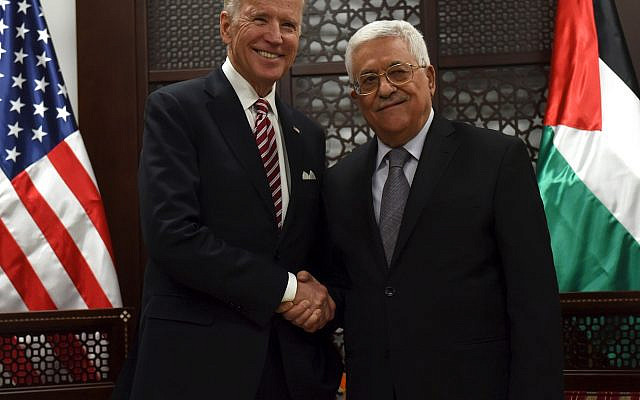 U.S. Vice-President Joe Biden (L) shakes hands with Palestinian President Mahmoud Abbas in the West Bank city of Ramallah March 9, 2016. REUTERS/Debbie Hill/Pool      TPX IMAGES OF THE DAY
