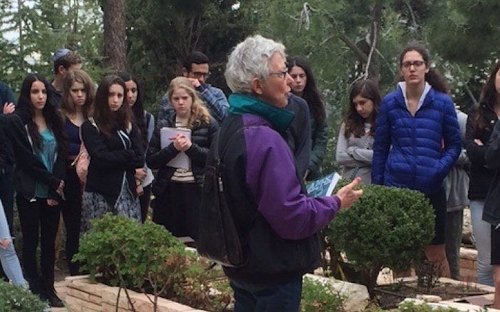 Suzanne Singer z"l next to the grave of her son Alex z"l on Mt Herzl. Photo (c) T. Book, 2022