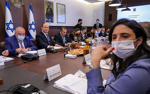 Minister Ayelet Shaked, foreground, looks on as Prime Minister Naftali Bennett leads a cabinet meeting at the Prime Minister's office in Jerusalem on November 28, 2021. (Marc Israel Sellem/POOL)