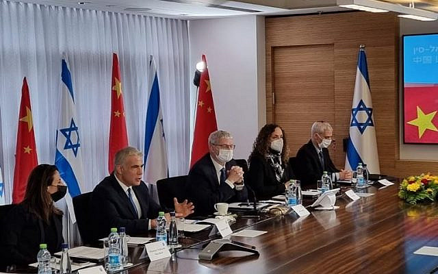Foreign Minister Yair Lapid (second from left) speaks at the Fifth Israel-China Joint Committee on Innovation meeting, January 24, 2022. (MFA)