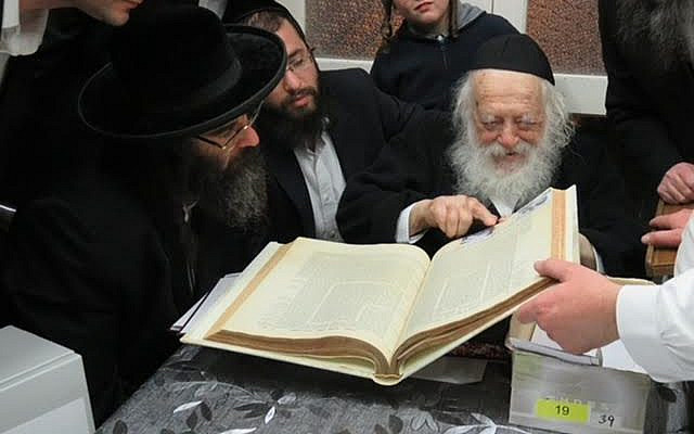 Rabbi Chaim Kanievsky, and his photograph illustrating the talmudic discussion of conjoined twins. (public domain)