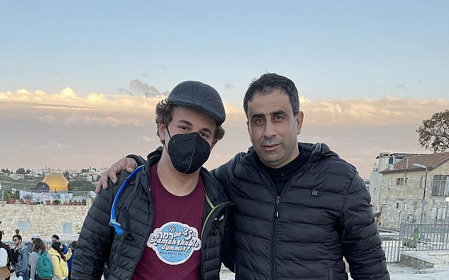 Me with the Palestinian man I met from Hebron in the Jerusalem Rooftops on February 24, 2022. The Old City and Dome of the Rock are visible in the background. (Credit: Luiz Gandelman)