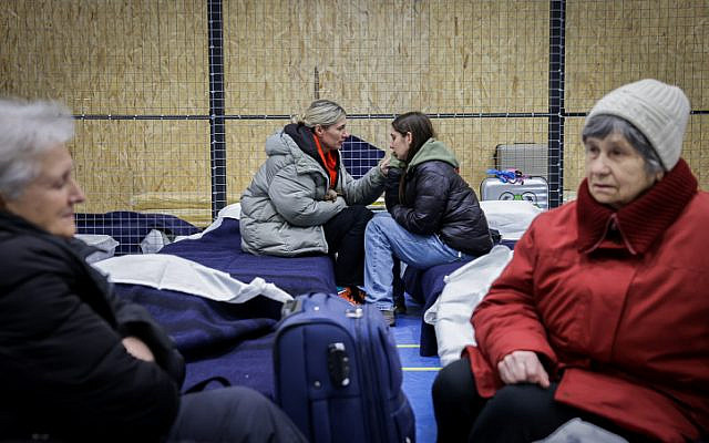 Jewish Ukrainian refugees sit at an emergency shelter sponsored by the IFCJ (International Fellowship of Christians and Jews) and the JDC in Chisinau, Moldova, March 5, 2022. (Nati Shohat/Flash90)