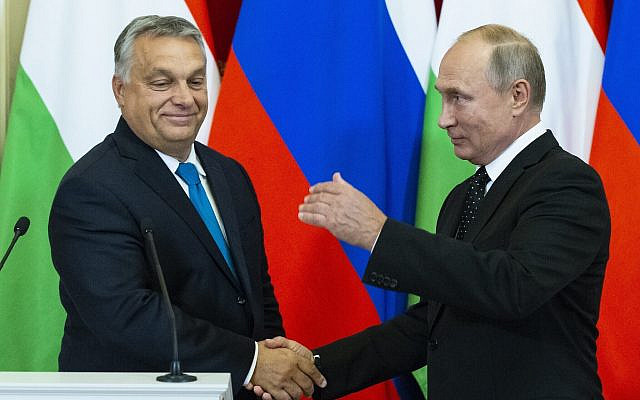 Russian President Vladimir Putin, right, shakes hands with Hungarian Prime Minister Viktor Orban during a joint news conference after their talks in the Kremlin in Moscow, Russia on Sept. 18, 2018. (AP Photo/Alexander Zemlianichenko, Pool)