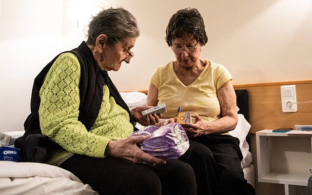 Kyiv residents Galina Chornobyl, left, and her daughter Olga Goriachko found shelter in Romania with the help of the American Jewish Joint Distribution Committee and the Federation of Romanian Jewish Communities, March 2022. (Arik Shraga)