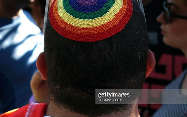 An Israeli man wears a rainbow a kippa, the traditional Jewish skullcap for men, during the annual Gay Pride march in Jerusalem on July 21, 2016.
Israeli police said they suspected the man behind the attack on last year's march, Yishai Shlissel, an ultra-Orthodox Jew who killed a teenager and stabbed five other people, had been in contact with his brother from prison about an assault on the event. / AFP / THOMAS COEX        (Photo credit should read THOMAS COEX/AFP via Getty Images)