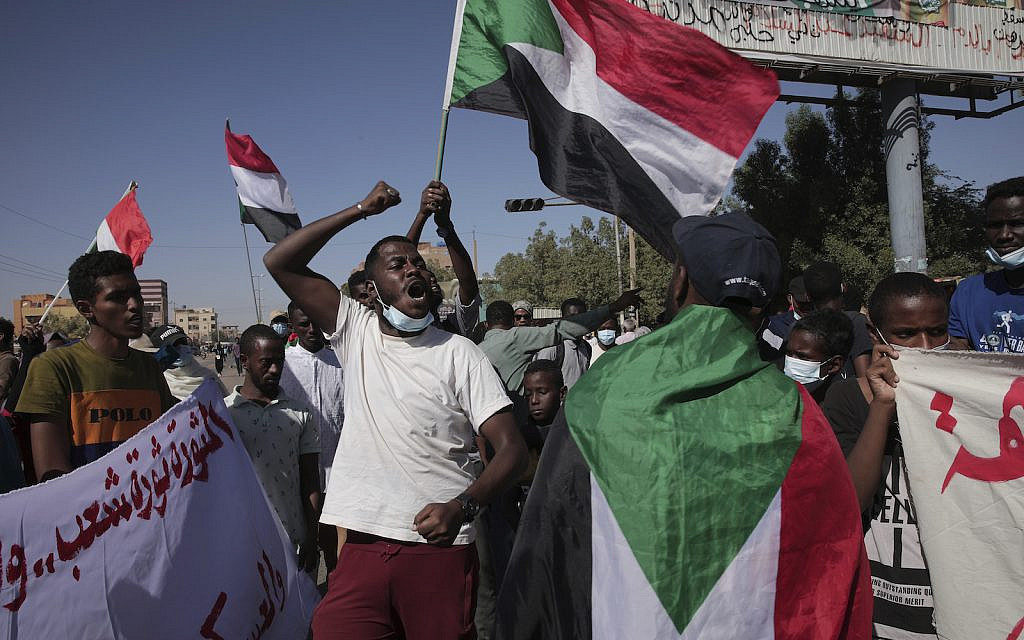 Thousands of protesters take to the streets to renew their demand for a civilian government in the Sudanese capital Khartoum, Thursday, Nov. 25, 2021 (AP Photo/Marwan Ali)