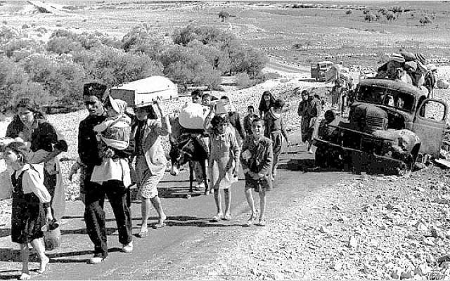 Palestine refugees making their way from the Galilee in October–November 1948. (Wikipedia)