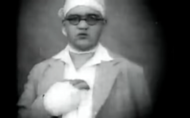 Illustrative. An injured man from the 1929 riots. (screenshot, YouTube)