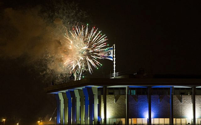 Fireworks from the Mount Herzl ceremony seen over the Knesset in Jerusalem, marking the beginning of the celebrations of Israel's 67th Independence Day, on April 22, 2015. (Yonatan Sindel/Flash90/File)