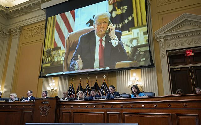 A video clip is displayed of President Donald Trump as the House select committee investigating the Jan. 6, 2021, attack on the Capitol holds a hearing at the Capitol in Washington, Thursday, June 16, 2022. (AP Photo/J. Scott Applewhite)