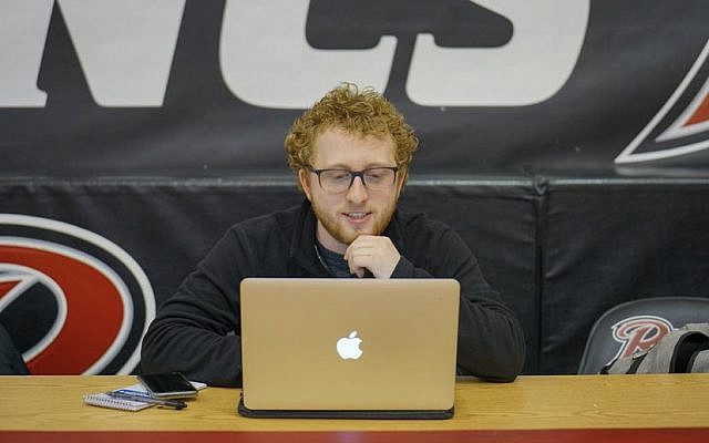 Dylan Manfre covering a Rider women's basketball game. *(Andrew Xon/The Rider News, by permission)