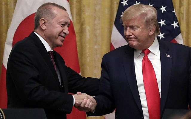 President Donald Trump shakes hands with Turkish President Recep Tayyip Erdogan after a news conference in the East Room of the White House, Wednesday, Nov. 13, 2019, in Washington. (AP Photo/ Evan Vucci)