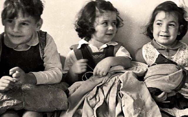 Children donate clothing for Jewish refugees in Cyprus, 1948. Photo: Benno Rothenberg, the Meitar Collection, the Pritzker Family National Photography Collection at the National Library of Israel