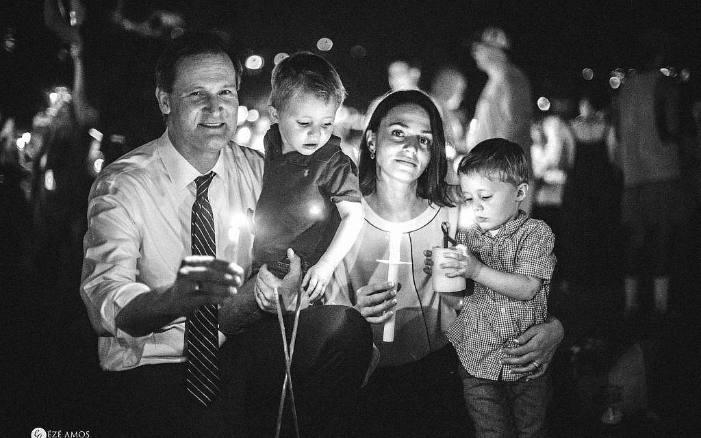 The author with her husband, then-Charlottesville-Mayor Mike Signer, and their children at a vigil commemorating the violent, 2017 'Unite the Right' event in Charlottesville, Virginia. (Courtesy, Eze Amos)