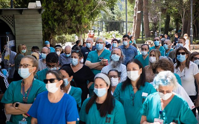 Doctors and nurses strike outside the Hadassah hospital in Jerusalem on August 25, 2021. Staff at public hospitals all over Israel were protesting the lack of budget for the Israeli healthcare system. (Yonatan Sindel/Flash90)
