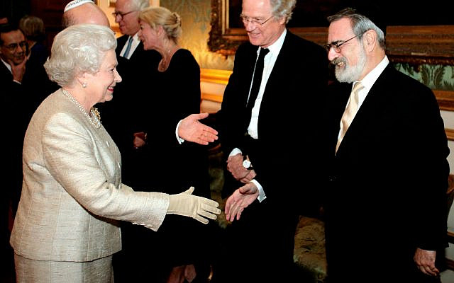 Queen Elizabeth II meets Chief Rabbi Jonathan Sacks at a reception at St. James’s Palace in London to mark the 350th anniversary of the re-establishment of the Jewish community in Britain, Nov. 28, 2006. (Andrew Parsons/PA Images via Getty Images)
