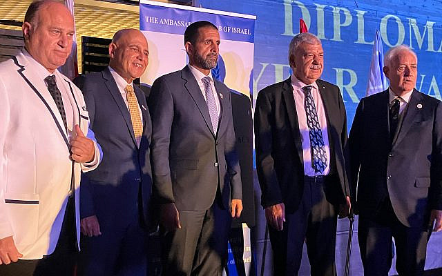 From left: Yoram Naor, honorary consul-general of Belize in Israel; David Fattal, CEO of Fattal Hotels; Khaled Yousef Al Jalahma, Bahrain's ambassador to Israel; Abderrahim Beyyoudh, Morocco's ambassador to Israel, and Yitzhak Eldan, president of the Ambassadors Club of Israel, appear on stage Sept. 21 at the club's annual "Diplomat of the Year" ceremony in Herzliyya. (Photo by Larry Luxner)