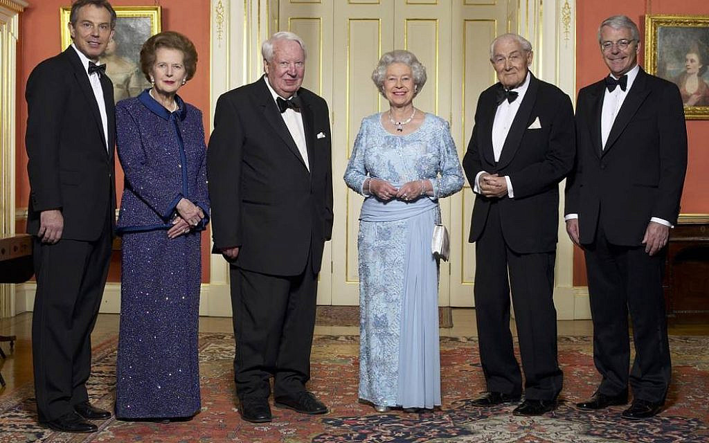 Queen Elizabeth II, at a Golden Jubilee dinner with then-British prime minister Tony Blair and former prime ministers, (from left to right) Margaret Thatcher (left of Blair), Edward Heath, James Callaghan, and John Major, on February 6, 2022. (UK government, via Wikipedia)