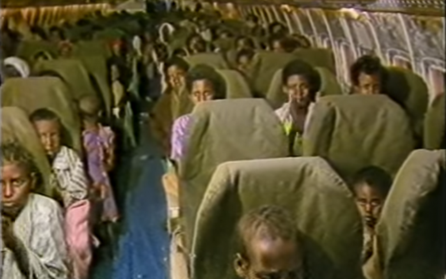 Illustrative: Ethiopian Jews aboard an Israeli plane during Operation Moses (November 21, 1984 – January 5, 1985). (Screen grab from The Spielberg Jewish Film Archive)