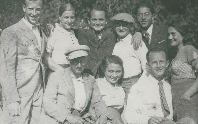 My mother is second from left, standing above my father, posing in the Polish countryside with friends and relatives, circa 1930s.