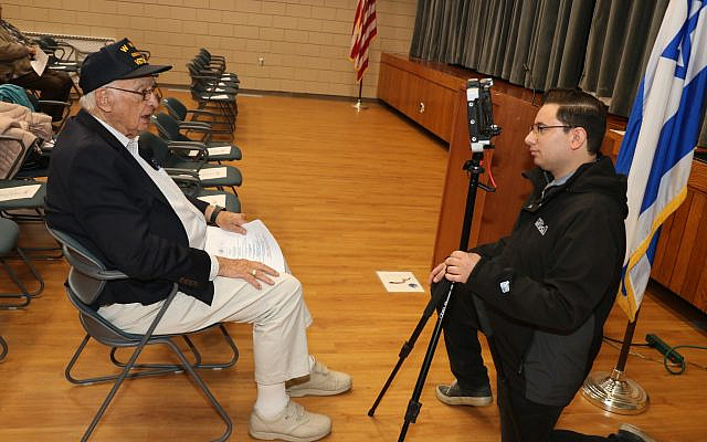Cam Jandrow (Spectrum News Channel 1, Worcester) interviews WWII veteran David Sadick.